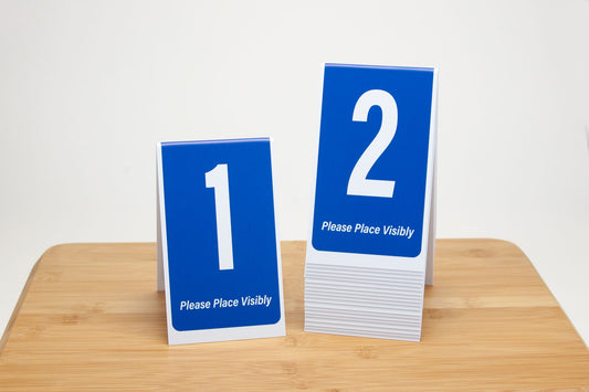 6in tall tent style blue table numbers.